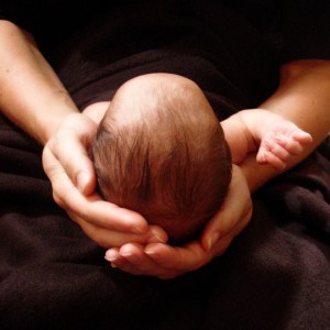 Newborn in mother's hands